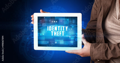 Wallpaper Mural Person holding tablet, security concept Torontodigital.ca