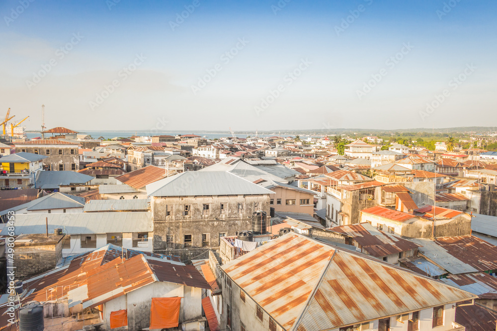Old town of Stone Town, Zanzibar landmark. Panoramic cityscape of Stone Town with rooftops and aerial view. African culture and ethnicity. Travel in Africa. Summer journey in Tanzania. 