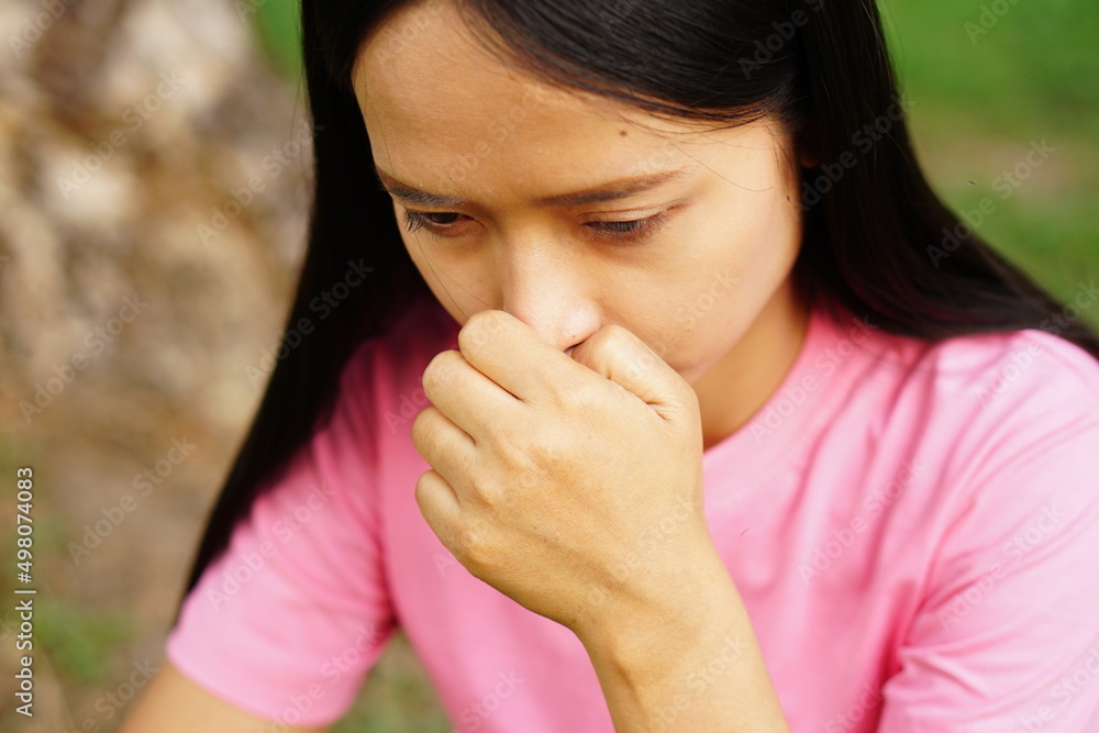 woman has an itchy nose.