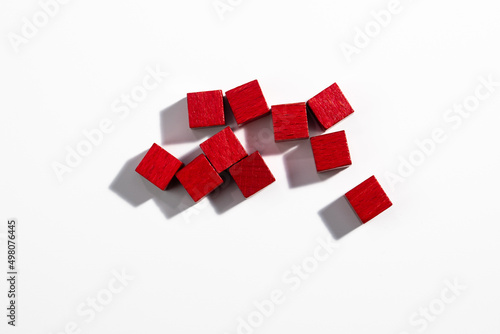 Top View of Red Wooden Game Cubes on White Background