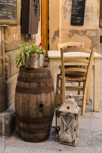 charming Italian restaurant with barrel plant and outdoor seating  © gammaphotostudio