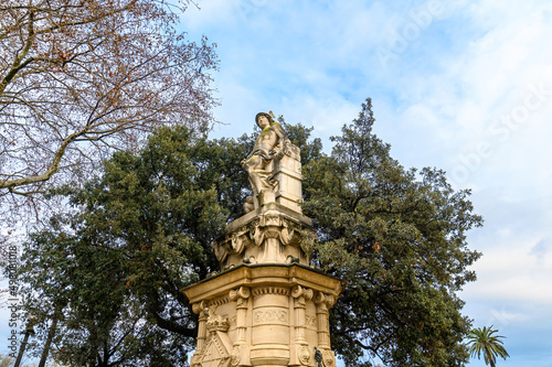 Statue in front of Castle of Tres Dragons in Parc de la Ciutadella in Barcelona, Spain photo