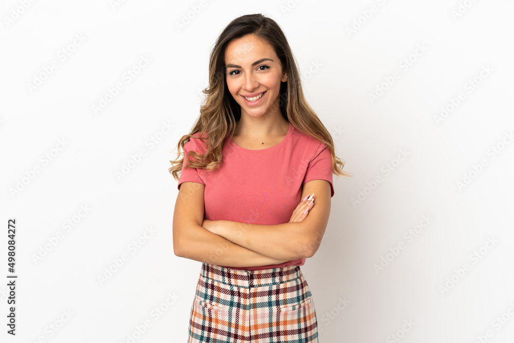 Young woman over isolated background keeping the arms crossed in frontal position Young woman over isolated background keeping the arms crossed in frontal position