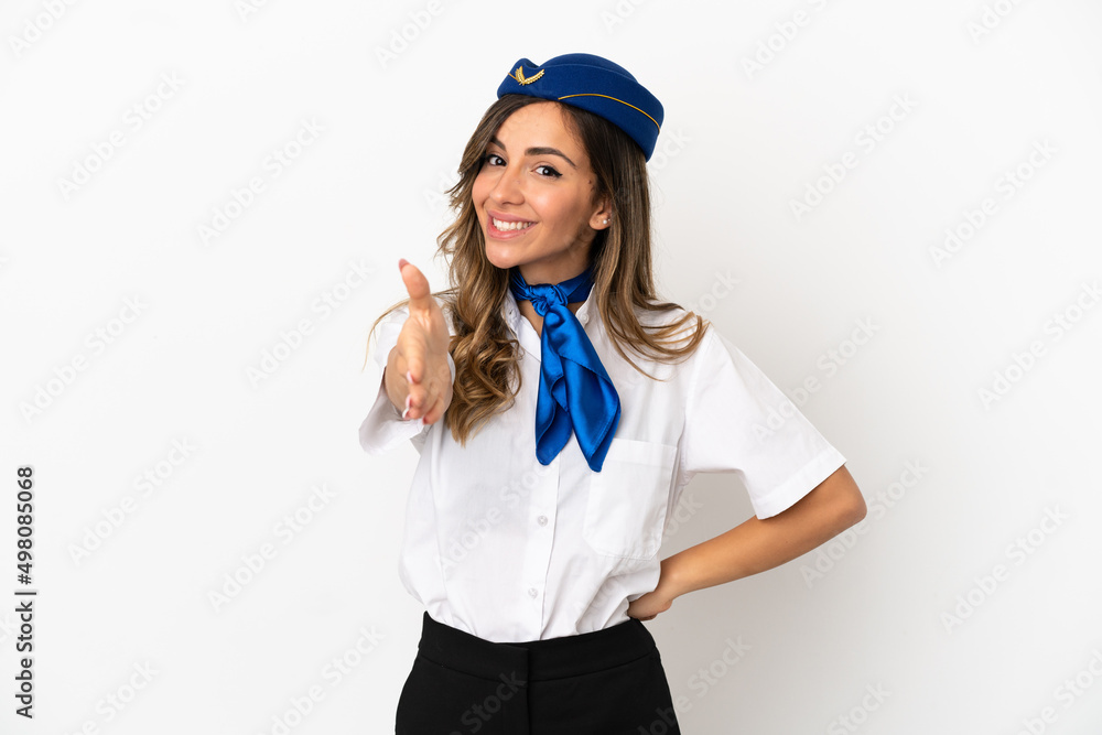 Airplane stewardess over isolated white background shaking hands for closing a good deal Airplane stewardess over isolated white background shaking hands for closing a good deal