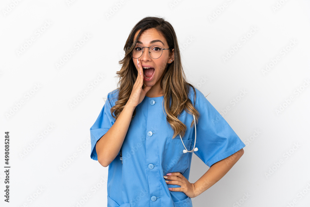 Young surgeon doctor woman over isolated white wall with surprise and shocked facial expression Young surgeon doctor woman over isolated white wall with surprise and shocked facial expression