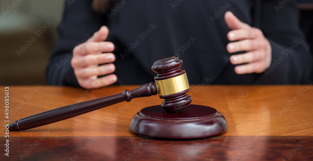 Judge gavel on law court bench, blur female hands, close up view. Judge gavel on law court bench, blur female hands, close up view.