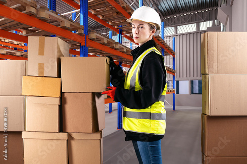 Warehouse woman. Girl in ye...
