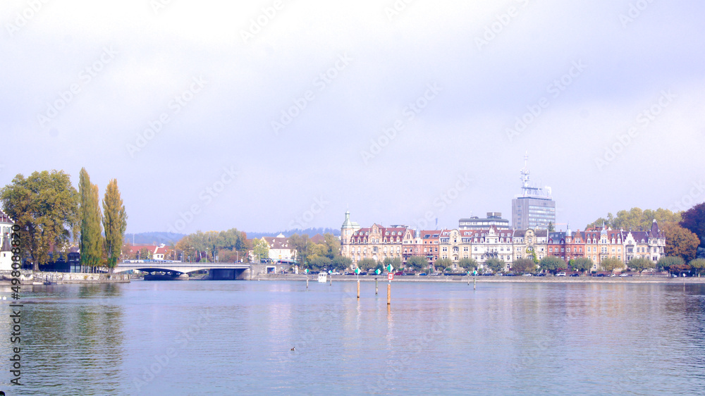 KONSTANZ, GERMANY - 14 OCT 2015: Lake Constance promenade with a bridge in the background