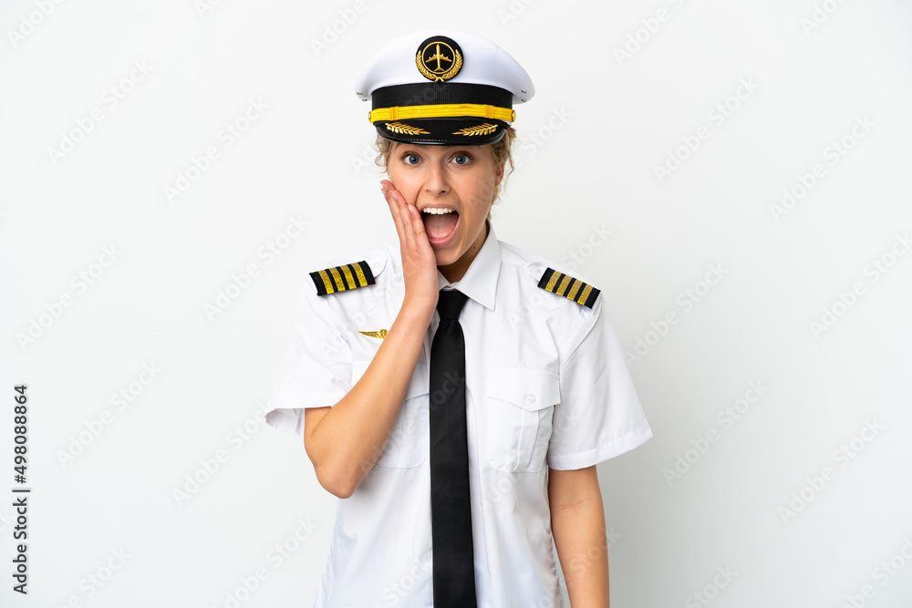 Airplane blonde woman pilot isolated on white background with surprise and shocked facial expression