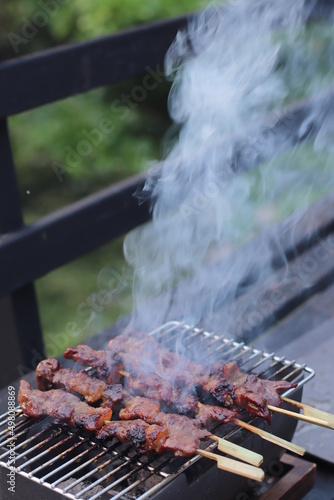 beef barbecue grilled with smoke for picnic.