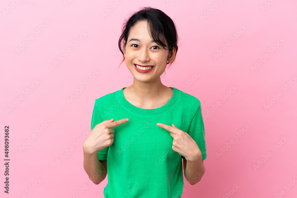 Young Vietnamese woman isolated on pink background with surprise facial expression Young Vietnamese woman isolated on pink background with surprise facial expression