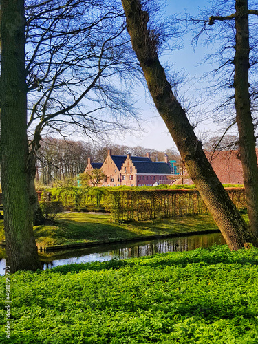 The Menkemaborg, a late-medieval fortified brick mansion surrounded by a traditional garden, in Uithuizen, province of Groningen, the Netherlands 