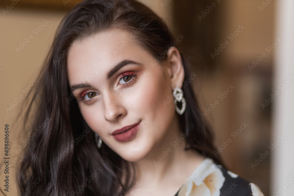 Front view portrait of atractive dark haired young woman. Horizontally. 