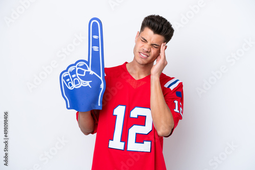 Young caucasian sports fan man isolated on white background with headache