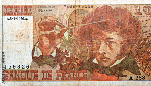 Large fragment of the obverse side of 10 ten French cent francs banknote currency by Bank of France features portrait of Louis Hector Berlioz, old French money, ancient vintage retro, uncirculated