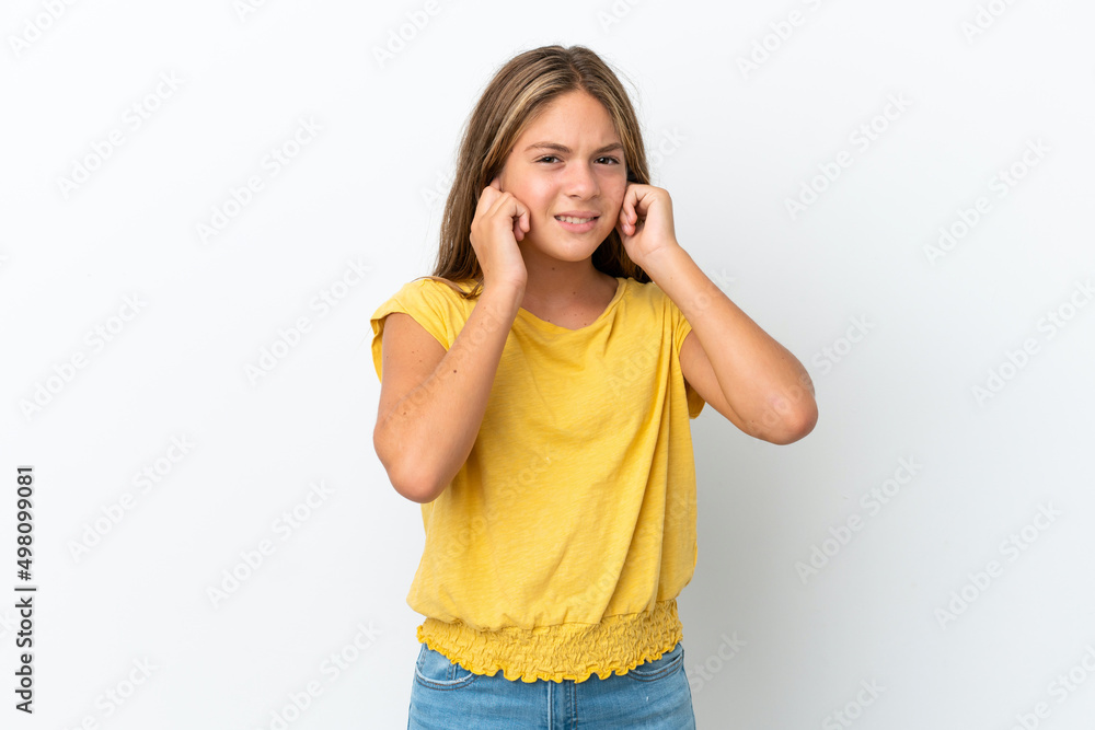 Little caucasian girl isolated on white background frustrated and covering ears Little caucasian girl isolated on white background frustrated and covering ears