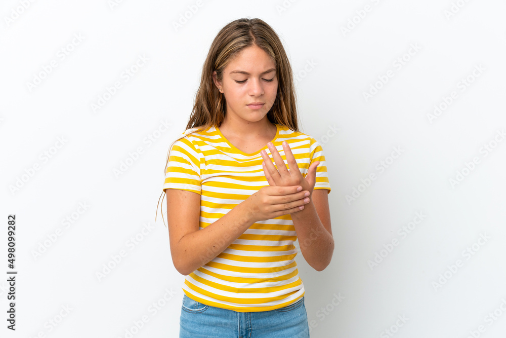 Little caucasian girl isolated on white background suffering from pain in hands Little caucasian girl isolated on white background suffering from pain in hands