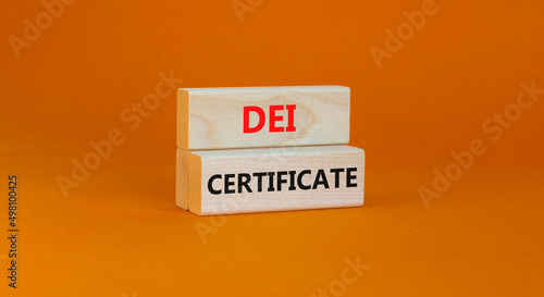 DEI diversity equity inclusion certificate symbol. Blocks with words DEI certificate on beautiful orange background. Business DEI diversity equity inclusion certificate concept. Copy space.