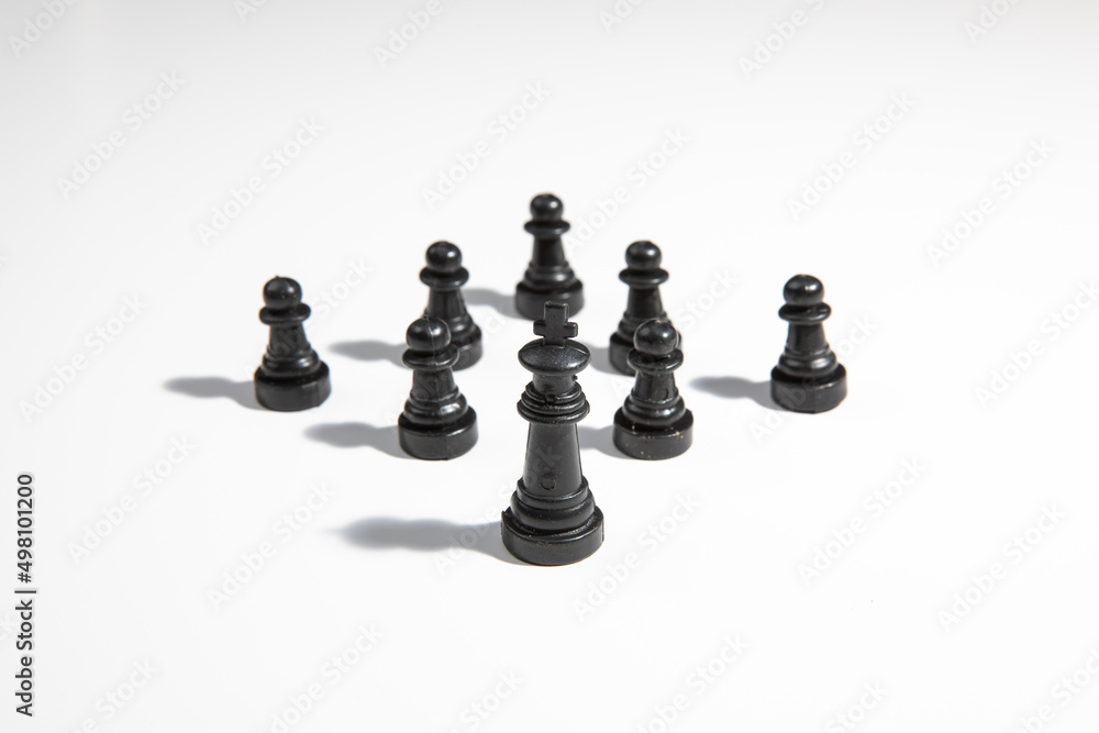 Black chess king with hard working team Black chess king with hard working team