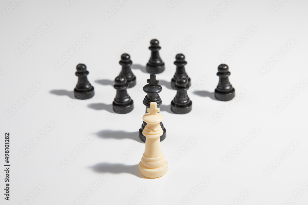 Confrontation - lone white chess king about to loose Confrontation - lone white chess king about to loose
