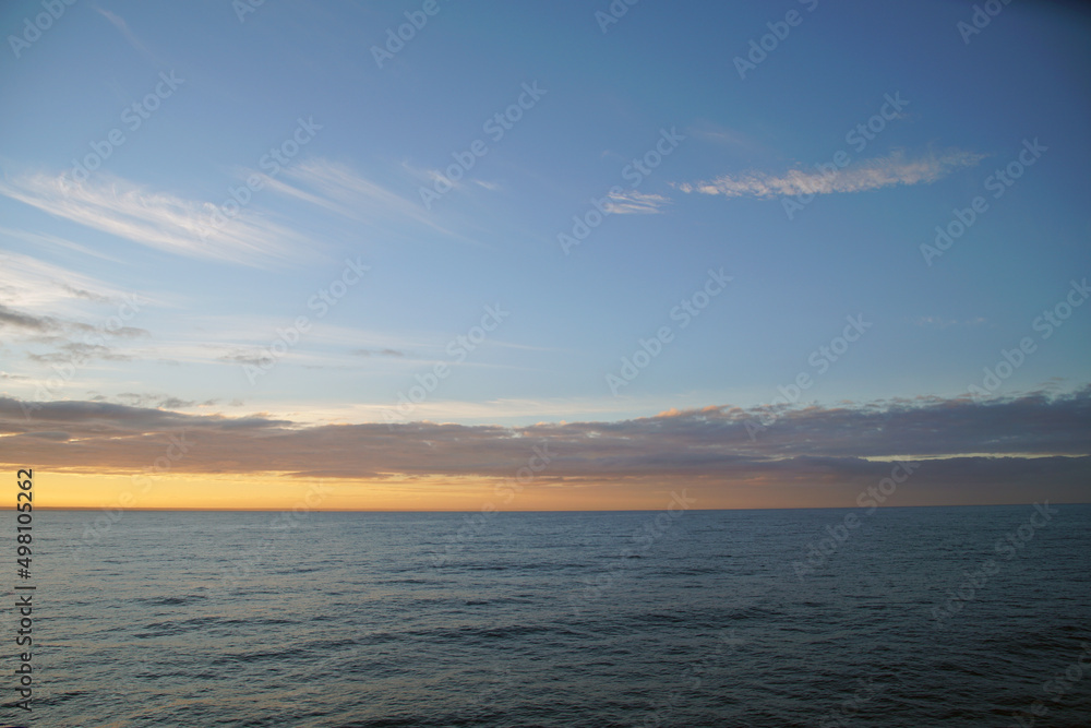 Early morning on the open ocean. The horizon is waiting for the sun. Space before sunrise
