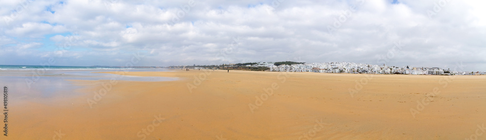 Panoramic view of the beach and the sea with the white houses town of Conil, Cadiz, Spain