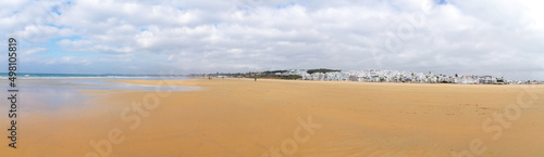 Panoramic view of the beach and the sea with the white houses town of Conil, Cadiz, Spain