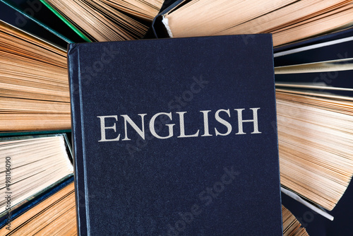 Old hardcover books with a book English on top.