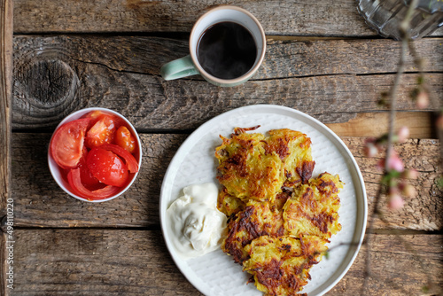 Wallpaper Mural Draniki and cucumbers on a blue plate. Top view, wooden background Torontodigital.ca