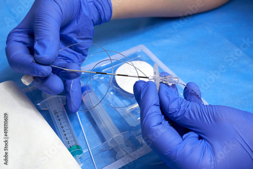 Preparation for epidural anesthesia. Epidural catheter in the hands of a medic close-up photo