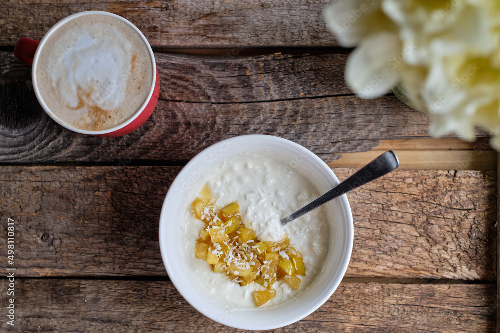 bowl of rice with pear, coconut and milk bowl of rice with pear, coconut and milk