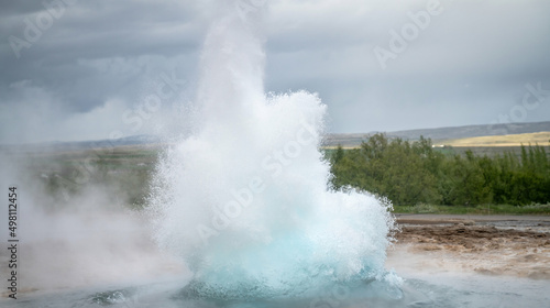 Strokkur, Iceland - May 2019: Strokkur geyser eruption in the Strokkur geothermal area