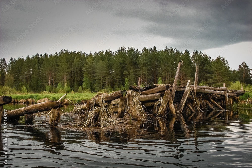 destroyed wooden bridge on the river destroyed wooden bridge on the river