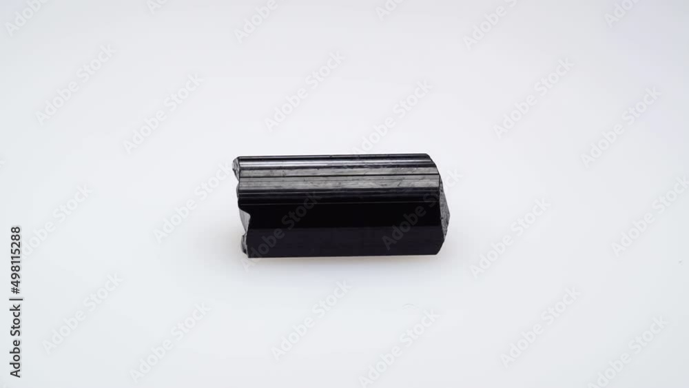 black tourmaline scherl rough specimen in the tweezers black tourmaline scherl rough specimen in the tweezers
