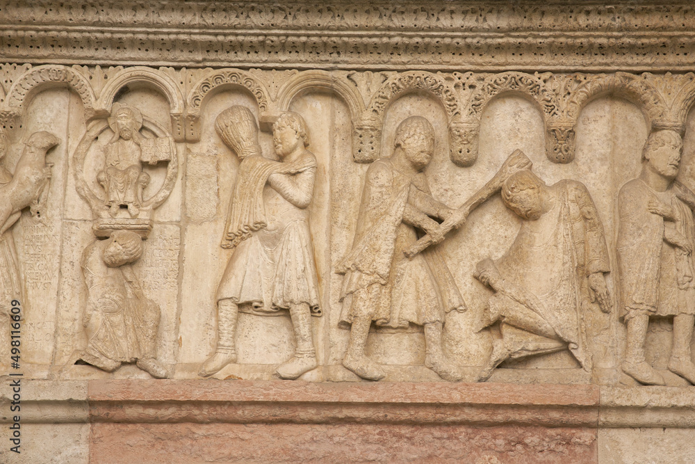 Close up of sculptures on the facade of the cathedral of Modena, Italy.