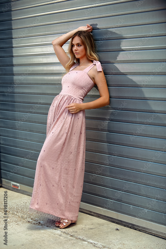 Girl in the summer dress enjoys the spring Girl in the summer dress enjoys the spring