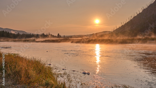 Fototapeta Naklejka Na Ścianę i Meble -  Fog at Sunrise. Beautiful Reflection on the Yellowstone River