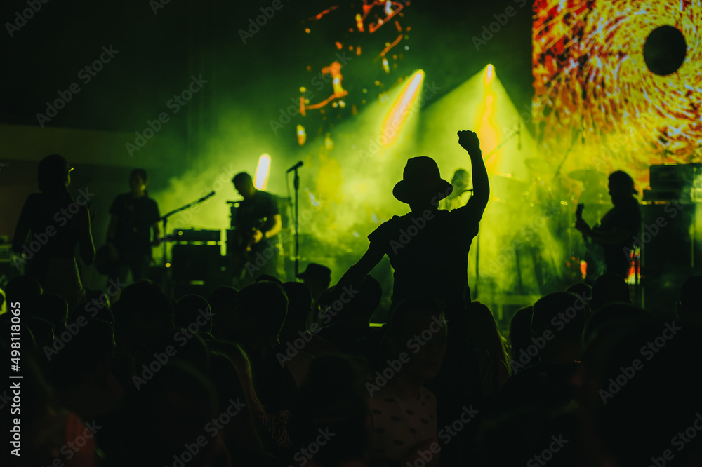 Man in a concert audience having fun on a music festival