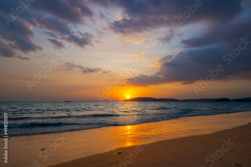 Sunset over the tropical sea and beautiful dramatic clouds. © Jordanj