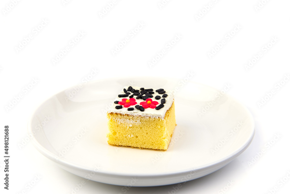 Square cake on white plate Square cake on white plate