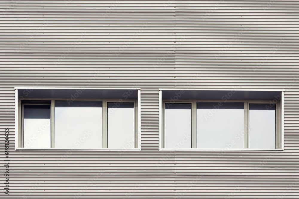 Urban office windows. Close up of a modern building facade. Urban office windows. Close up of a modern building facade.