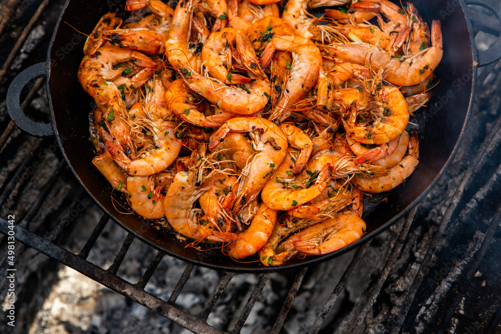 crispy fresh shrimp cooked on a frying pan in the wild. Rest in nature with fresh food
crispy fresh shrimp cooked on a frying pan in the wild. Rest in nature with fresh food