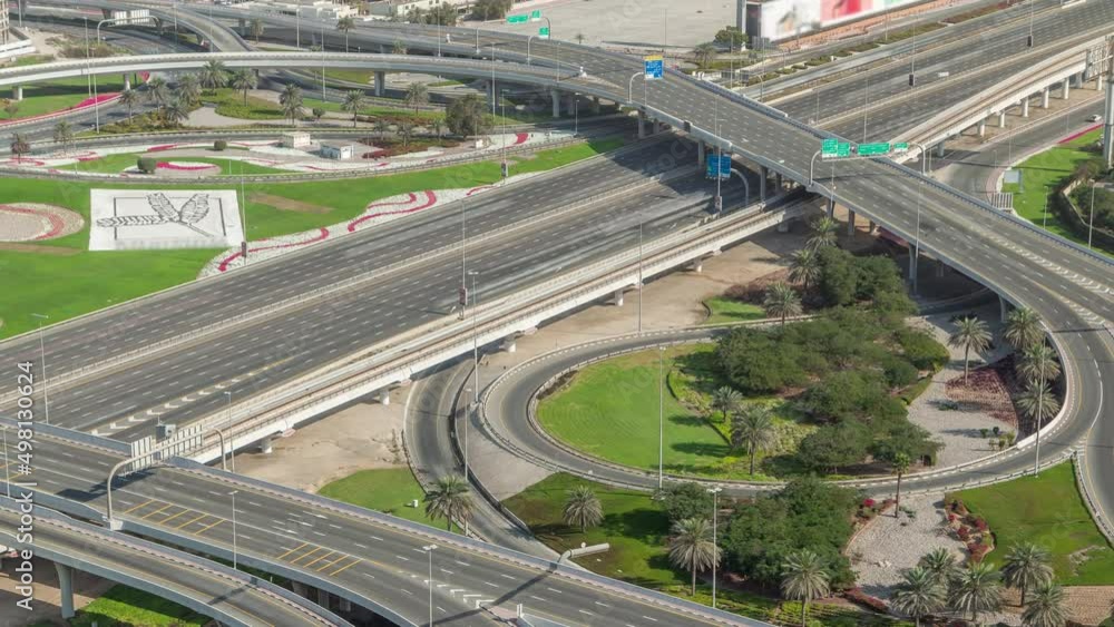 Aerial view on Dubai Marina with big highway intersection timelapse and skyscrapers around, UAE Aerial view on Dubai Marina with big highway intersection timelapse and skyscrapers around, UAE