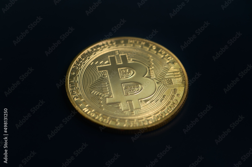 Golden Bitcoin isolated on black Golden Bitcoin isolated on black