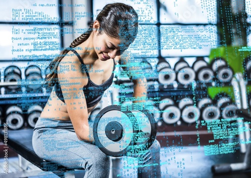 Composite image of data processing against asian fit woman working out at the gym