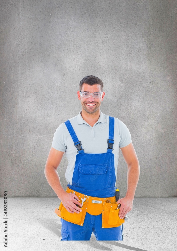 Portrait of caucasian male worker smiling against copy space on grey background Portrait of caucasian male worker smiling against copy space on grey background