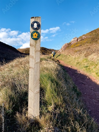 Wales Coast Path signpost in Pembrokeshire, UK near Freshwater West.