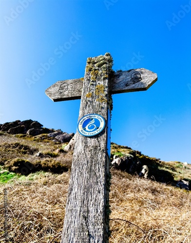 Wales Coast Path signpost in Pembrokeshire, UK near Freshwater West.