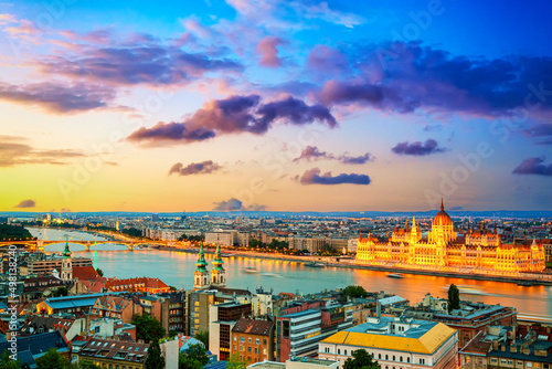 Parliament and riverside in Budapest, Hungary during colorful sunset