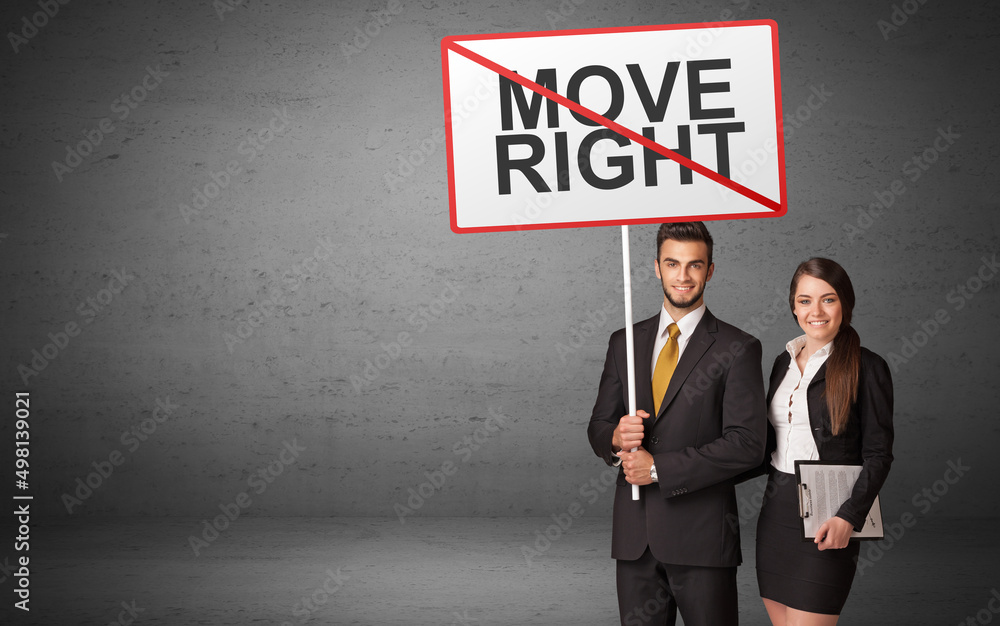 business person holding a traffic sign business person holding a traffic sign